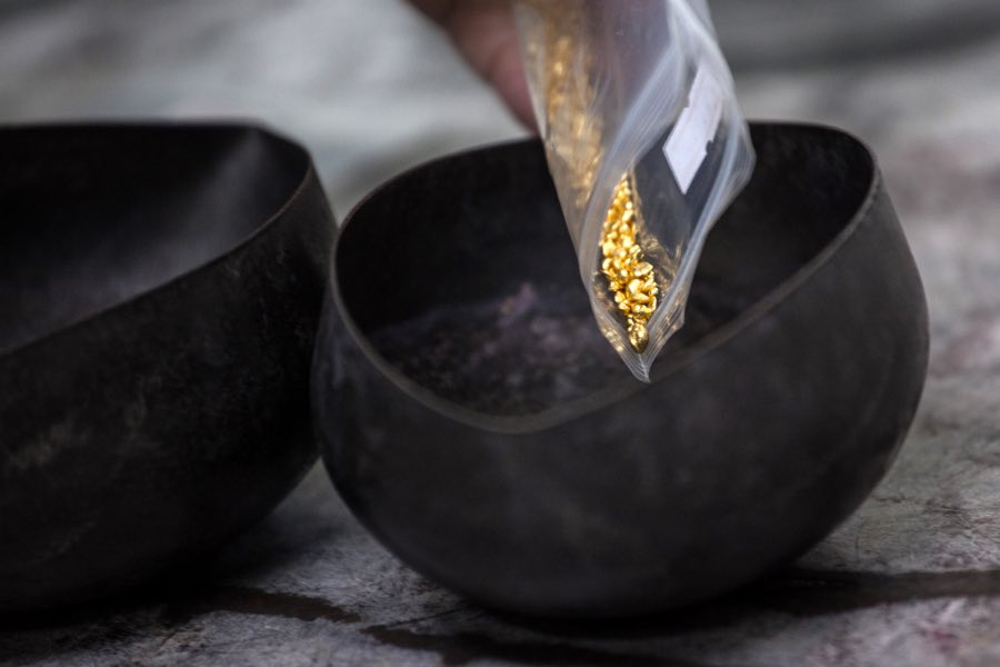 Gold casting grain weighed into crucibles at the Orogems factory