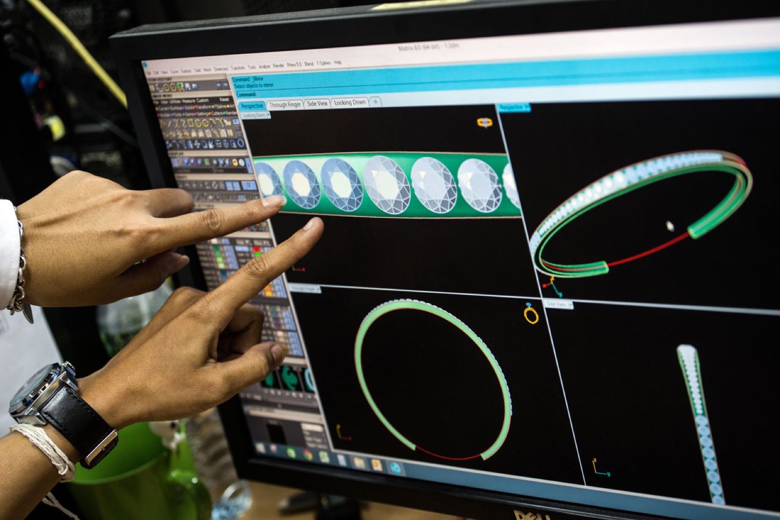 Orogems designer reviewing a CAD model of a diamond eternity band