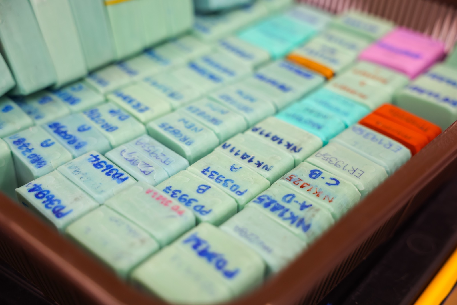Trays of labeled rubber production molds in the mold library