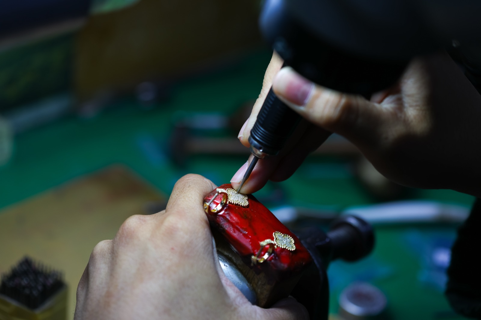 Gold components assembled and secured on the jeweler's shellac